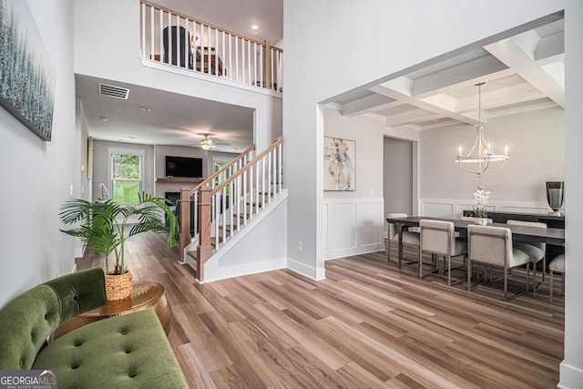 2 Whites Pond Rd, Moreland, GA 30259 - entrance foyer with wood finished floors, stairway, beam ceiling, a towering ceiling, and a chandelier