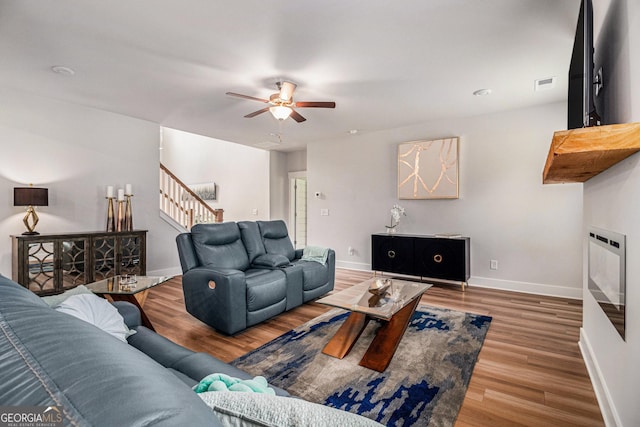 2 Whites Pond Rd, Moreland, GA 30259 - living area featuring stairway, ceiling fan, and wood finished floors