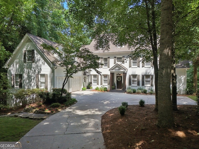 15305 Highgrove Rd, Milton, GA 30004 - view of front facade with concrete driveway and a garage
