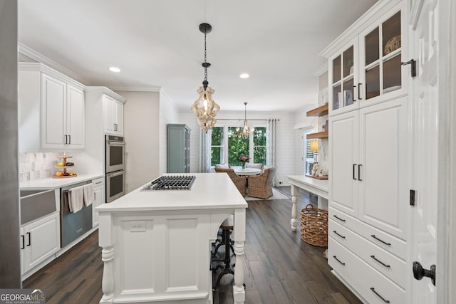 15305 Highgrove Rd, Milton, GA 30004 - kitchen with stainless steel appliances, recessed lighting, white cabinetry, a center island, and ornamental molding