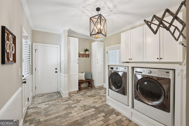 15305 Highgrove Rd, Milton, GA 30004 - washroom with washing machine and clothes dryer, brick patterned flooring, a chandelier, crown molding, and cabinet space