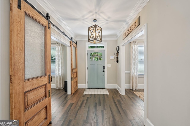 15305 Highgrove Rd, Milton, GA 30004 - foyer with a barn door, dark wood finished floors, and ornamental molding