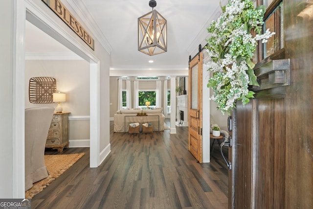 15305 Highgrove Rd, Milton, GA 30004 - entryway featuring a barn door, crown molding, dark wood-type flooring, and recessed lighting