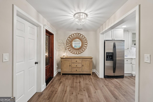 15305 Highgrove Rd, Milton, GA 30004 - foyer with a chandelier and light wood-style floors