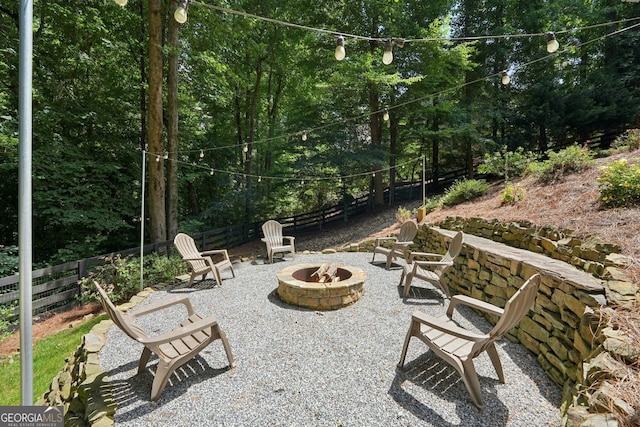15305 Highgrove Rd, Milton, GA 30004 - view of patio featuring a fire pit
