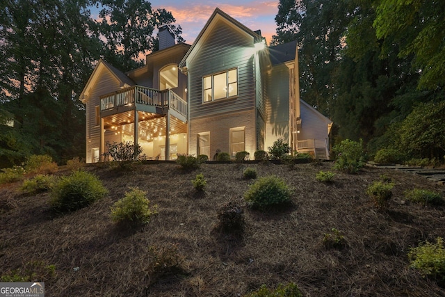 15305 Highgrove Rd, Milton, GA 30004 - view of front of property featuring a chimney, a balcony, and brick siding