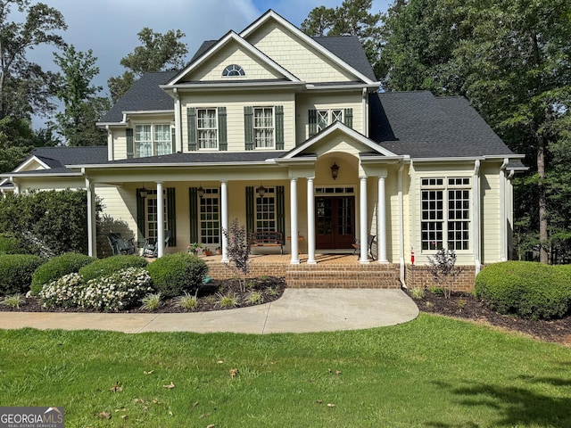 286 Timberlake Dr, Martin, GA 30557 - craftsman house featuring covered porch, french doors, and a front yard