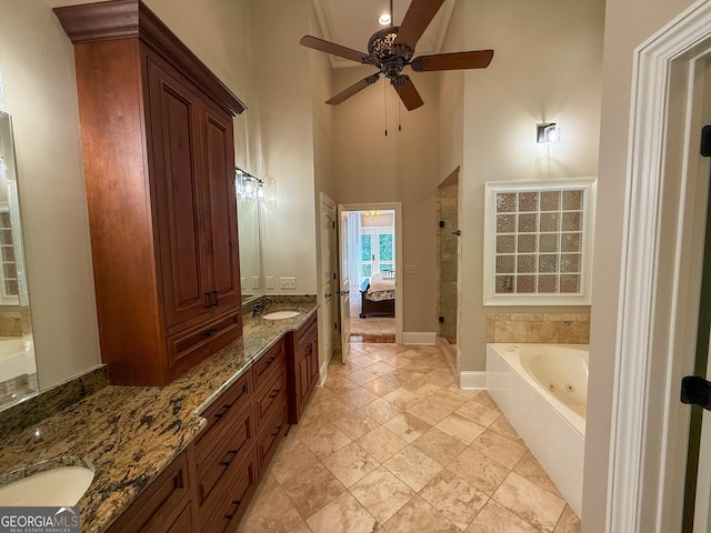 286 Timberlake Dr, Martin, GA 30557 - ensuite bathroom featuring a jetted tub, double vanity, a ceiling fan, a high ceiling, and a shower stall
