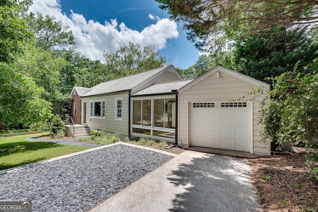 1131 Forrest Blvd, Decatur, GA 30030 - single story home with a garage, driveway, a shingled roof, and a front lawn