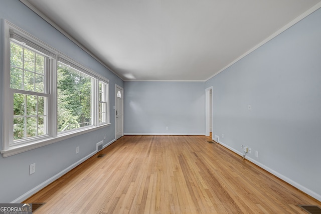 1131 Forrest Blvd, Decatur, GA 30030 - spare room featuring wood-type flooring and crown molding