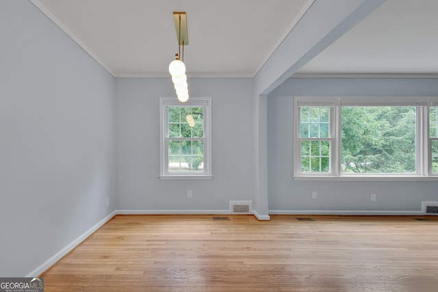 1131 Forrest Blvd, Decatur, GA 30030 - unfurnished room featuring plenty of natural light, crown molding, and wood finished floors