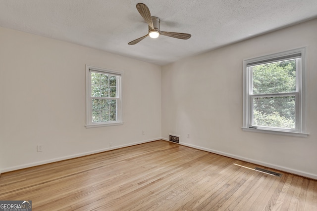 1131 Forrest Blvd, Decatur, GA 30030 - spare room with hardwood / wood-style flooring, ceiling fan, and a textured ceiling