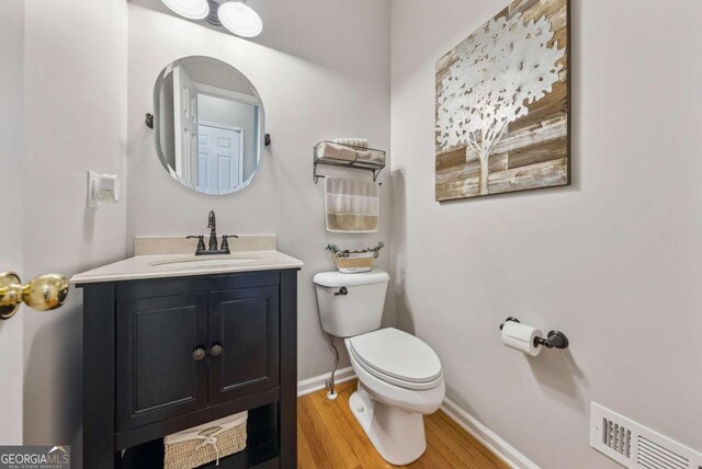 9320 Old Preserve Trl, Ball Ground, GA 30107 - bathroom with wood finished floors and vanity