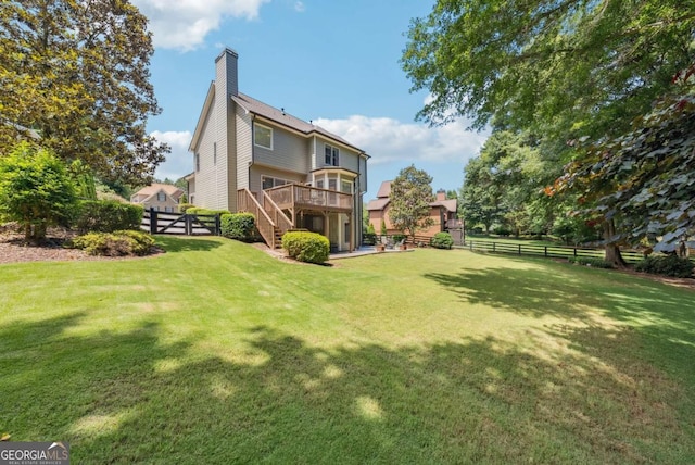9320 Old Preserve Trl, Ball Ground, GA 30107 - back of property with a fenced backyard, stairway, a wooden deck, and a chimney