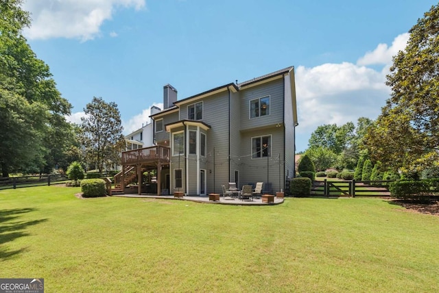 9320 Old Preserve Trl, Ball Ground, GA 30107 - rear view of house featuring stairway, a wooden deck, a patio, a fenced backyard, and a chimney