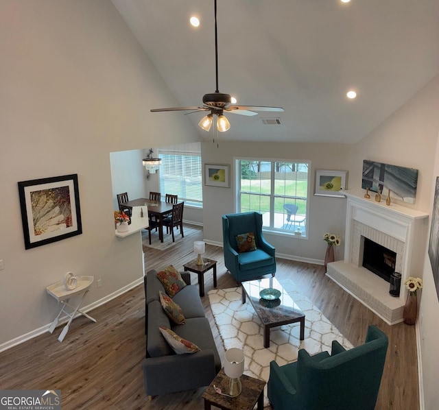 3066 Gem Creek Rd, Buford, GA 30519 - living room featuring wood finished floors, a ceiling fan, recessed lighting, a fireplace, and high vaulted ceiling