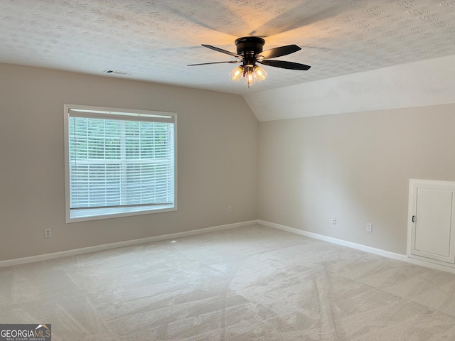 3066 Gem Creek Rd, Buford, GA 30519 - unfurnished room with a ceiling fan, light carpet, a textured ceiling, and vaulted ceiling