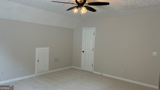 3066 Gem Creek Rd, Buford, GA 30519 - empty room featuring a textured ceiling, a ceiling fan, light colored carpet, and lofted ceiling