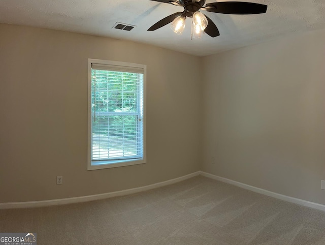 3066 Gem Creek Rd, Buford, GA 30519 - empty room featuring light colored carpet, plenty of natural light, and a ceiling fan