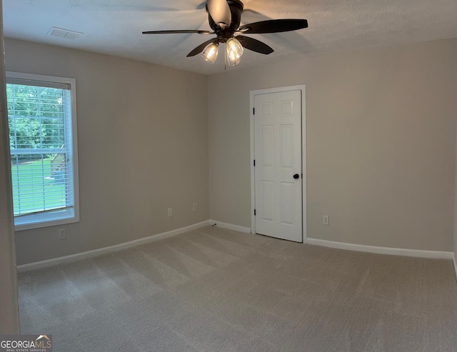 3066 Gem Creek Rd, Buford, GA 30519 - empty room featuring plenty of natural light, ceiling fan, light carpet, and a textured ceiling