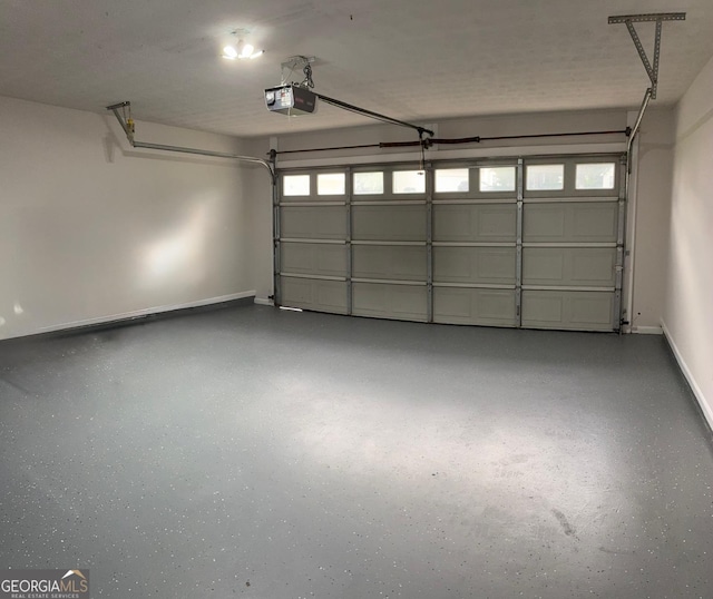 3066 Gem Creek Rd, Buford, GA 30519 - garage featuring a garage door opener and baseboards