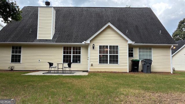 3066 Gem Creek Rd, Buford, GA 30519 - rear view of house with a patio area, roof with shingles, a lawn, and a chimney