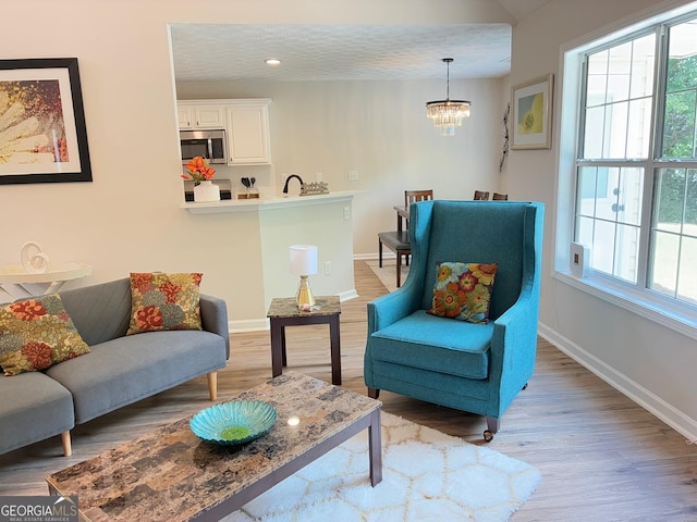 3066 Gem Creek Rd, Buford, GA 30519 - living area with light wood-style floors, a chandelier, and recessed lighting