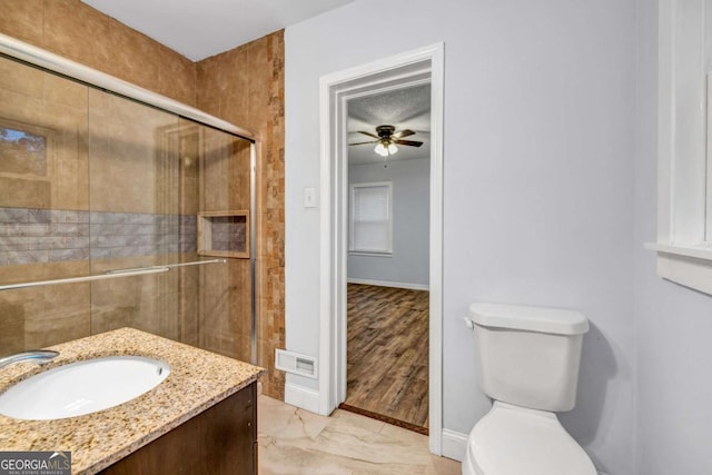 1747 Parkhill Dr, Decatur, GA 30032 - full bathroom with a tile shower, ceiling fan, vanity, and marble finish flooring
