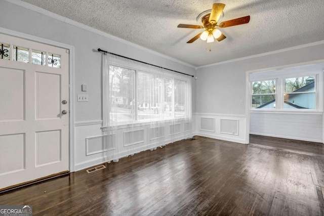 1747 Parkhill Dr, Decatur, GA 30032 - entrance foyer with a textured ceiling, a ceiling fan, a wainscoted wall, and wood finished floors
