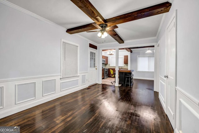 1747 Parkhill Dr, Decatur, GA 30032 - unfurnished living room featuring ceiling fan, beamed ceiling, dark wood finished floors, a decorative wall, and a wainscoted wall