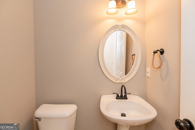2427 Camata Pl, Marietta, GA 30066 - half bathroom with a sink and toilet