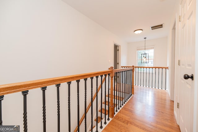 2427 Camata Pl, Marietta, GA 30066 - hallway with an upstairs landing and light wood-style floors