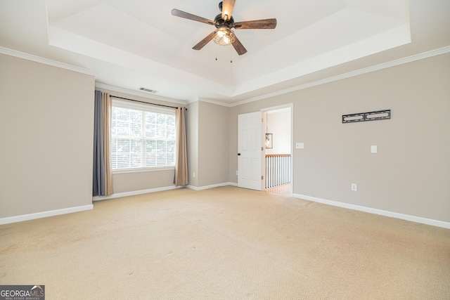 2427 Camata Pl, Marietta, GA 30066 - empty room with a raised ceiling, ceiling fan, light colored carpet, and crown molding
