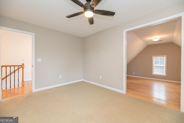 2427 Camata Pl, Marietta, GA 30066 - carpeted spare room featuring a ceiling fan, lofted ceiling, and wood finished floors