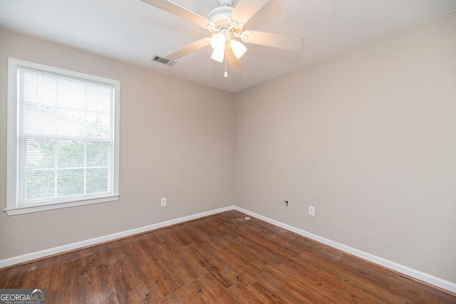 2427 Camata Pl, Marietta, GA 30066 - empty room with plenty of natural light, wood finished floors, and ceiling fan