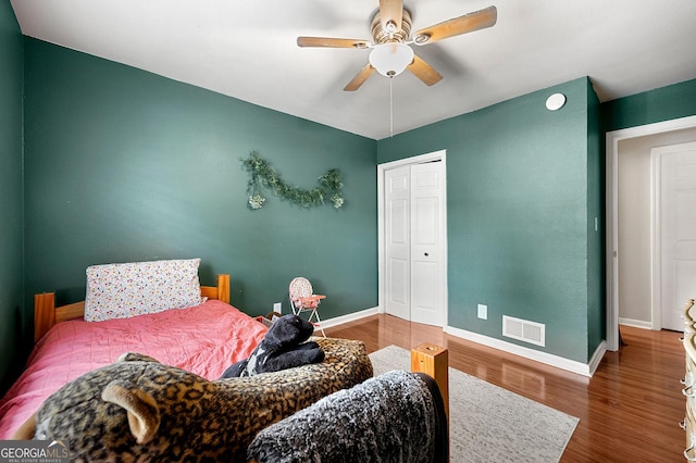 3149 Buford Hwy NE, Atlanta, GA 30329 - bedroom with wood finished floors, a ceiling fan, and a closet