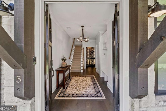 18 Peachtree Ave NE Unit 5, Atlanta, GA 30305 - foyer with wood finished floors, a chandelier, and crown molding