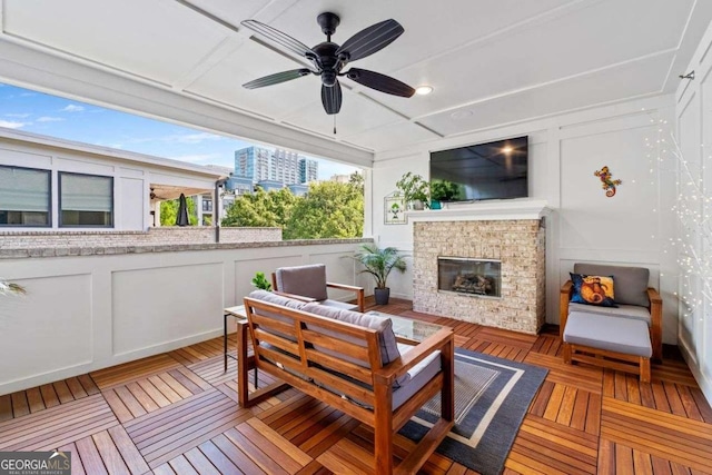 18 Peachtree Ave NE Unit 5, Atlanta, GA 30305 - deck with ceiling fan and an outdoor living space with a fireplace