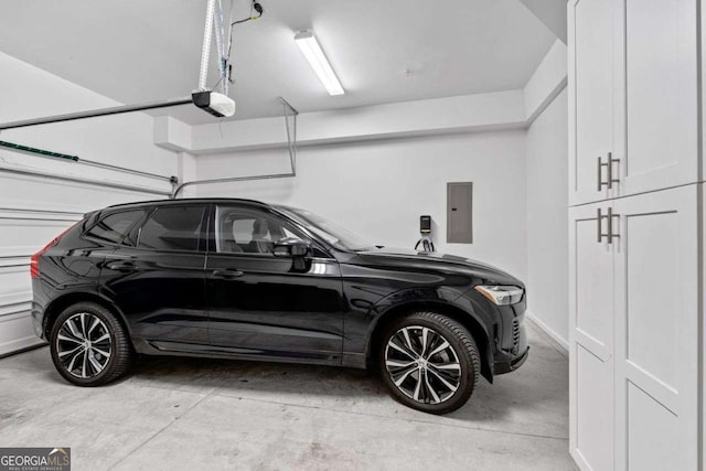 18 Peachtree Ave NE Unit 5, Atlanta, GA 30305 - garage featuring a garage door opener and electric panel