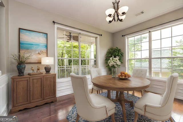 24 Arendt Park Ln, Newnan, GA 30263 - dining area with a chandelier, hardwood / wood-style flooring, a wainscoted wall, and a decorative wall