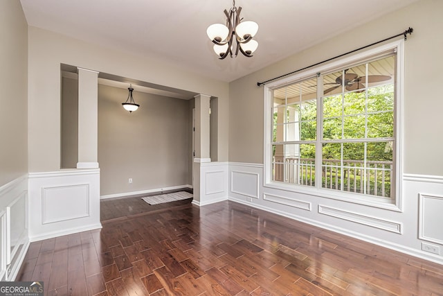 24 Arendt Park Ln, Newnan, GA 30263 - unfurnished room featuring a chandelier, wainscoting, a decorative wall, and wood finished floors
