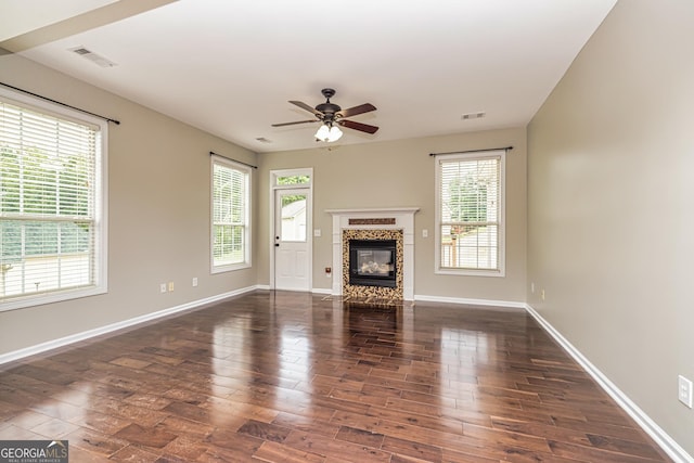 24 Arendt Park Ln, Newnan, GA 30263 - unfurnished living room featuring wood finished floors, ceiling fan, and a glass covered fireplace
