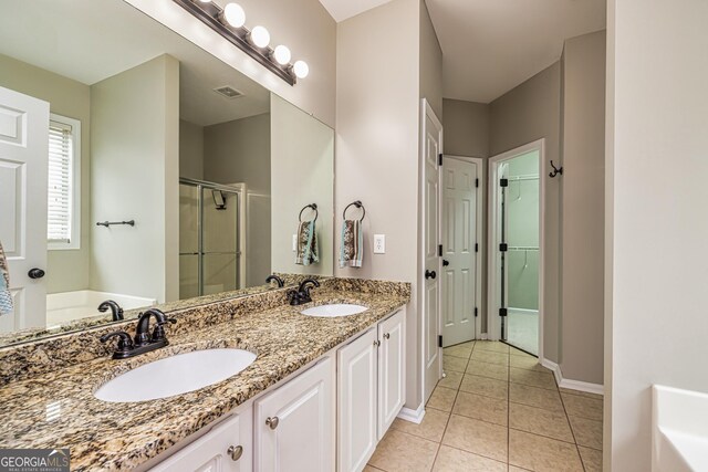 24 Arendt Park Ln, Newnan, GA 30263 - bathroom with a shower stall, tile patterned floors, double vanity, and a garden tub