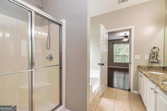 24 Arendt Park Ln, Newnan, GA 30263 - full bath featuring a shower stall, a bath, double vanity, tile patterned flooring, and ceiling fan