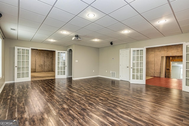 24 Arendt Park Ln, Newnan, GA 30263 - spare room featuring french doors, arched walkways, wood finished floors, and recessed lighting