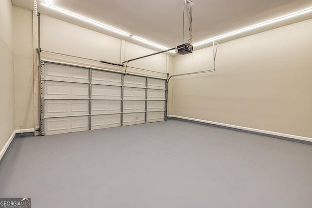 24 Arendt Park Ln, Newnan, GA 30263 - garage featuring baseboards and a garage door opener