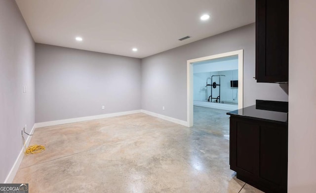 497 Rutherford St, Athens, GA 30606 - empty room featuring concrete flooring and recessed lighting