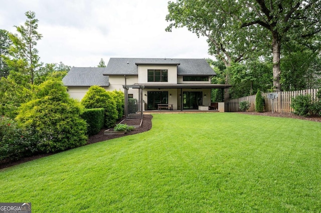 497 Rutherford St, Athens, GA 30606 - back of property featuring a shingled roof and a patio area
