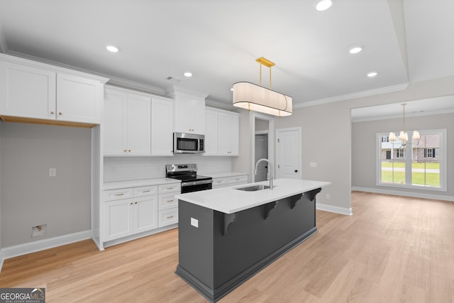 10 Honeysuckle Dr, Claxton, GA 30417 - kitchen featuring appliances with stainless steel finishes, crown molding, white cabinetry, decorative backsplash, and a chandelier