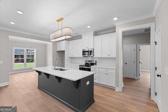 10 Honeysuckle Dr, Claxton, GA 30417 - kitchen with appliances with stainless steel finishes, white cabinets, a breakfast bar, tasteful backsplash, and crown molding